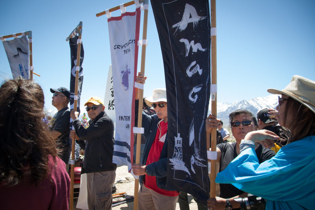 Eleven flags represent each of the 10 concentration camps and the 442nd Infantry Regiment. They are held by representatives each year at the Manzanar Pilgrimage to honor all of the internees, sites and veterans. Photo by Joanne Kim