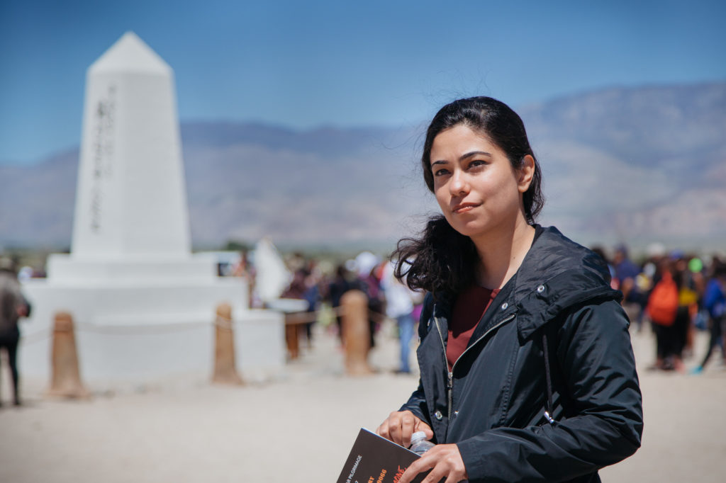 Asmaa Ahmed of the Council on American-Islamic Relations spoke as part of the 48th Annual Manzanar Pilgrimage’s program. She connected Roosevelt’s Executive Order 9066 with Trump’s Executive Order 13769, the travel ban on seven Muslim-majority countries. “The two orders are separated by a period of 75 years, but both were born out of the same culture of fear and prejudice.” Photo by Joanne Kim