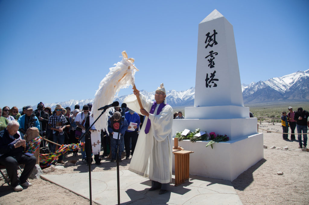Rev. Alfred Yoshi Suyuki of the Konko Church leads a Shinto ceremony to begin the interfaith service at the I Rei To monument. Photo by Joanne Kim