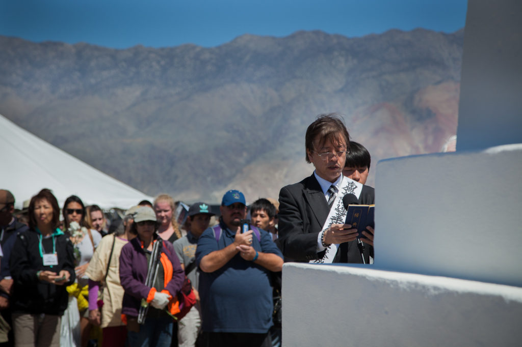 Buddhist minister reads a sutra as part of the interfaith service at the Manzanar Pilgrimage. Photo by Joanne Kim