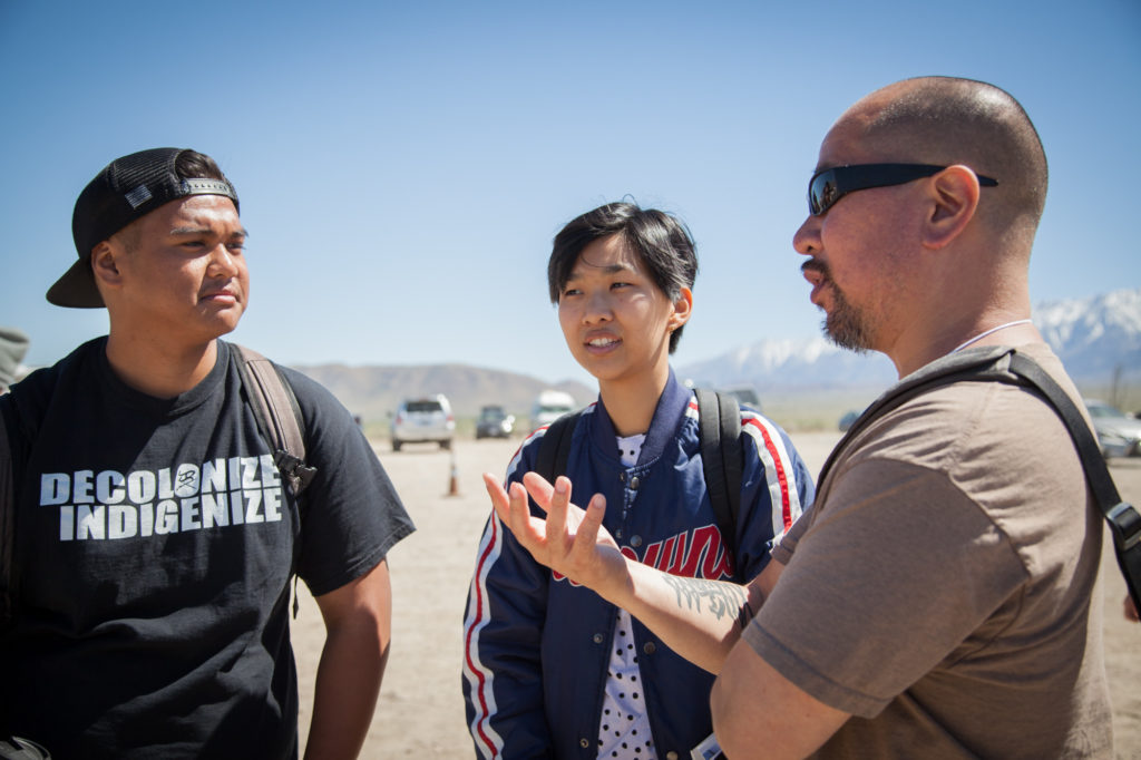 Steve Wong, Asian American Studies instructor, and two Pasadena City College students. Wong described the importance of coming to Manzanar and recognizing the danger of rhetoric that scapegoats marginalized groups for "military necessity” as happened with those of Japanese descent during WWII and is currently happening with Muslim groups under the Trump administration. Photo by Joanne Kim