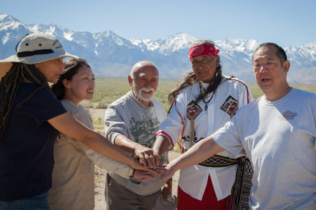 Runners from the Manzanar 50/500, which is a relay run from Los Angeles to Manzanar in its 26th year. Mo Nishida (center), the founder of the run, felt it was a way to connect with the Native American communities and the cultural and spiritual uses of running. Danny Ramos (right) has been running with him for 10 years. Photo by Joanne Kim