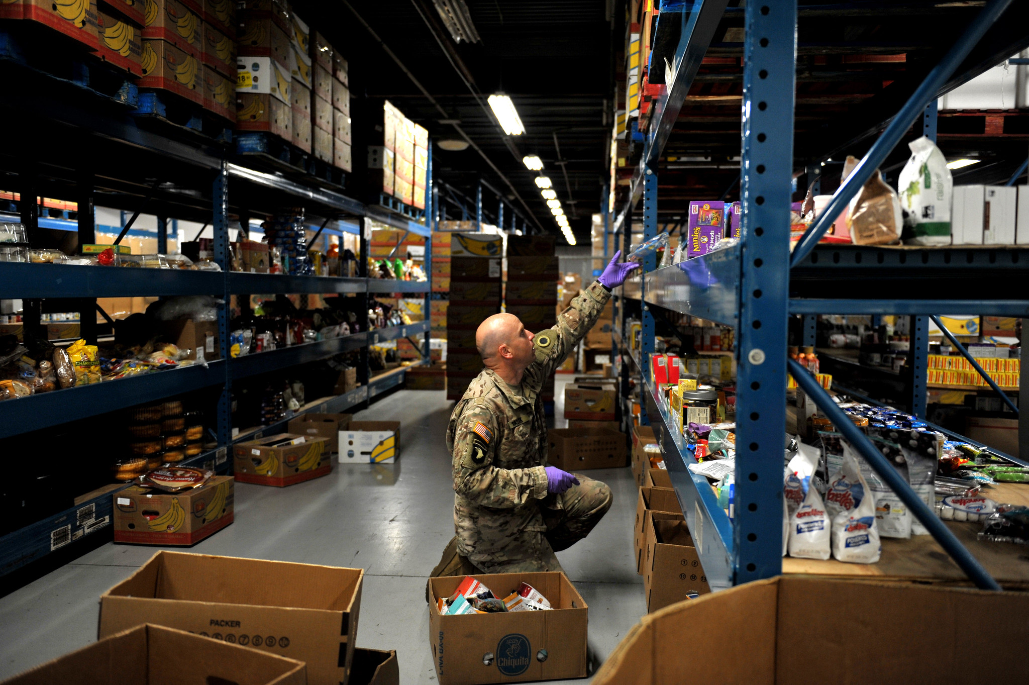 A U.S. Army National Guard Soldier, SSG Daniel Rasik, assigned to the Ohio National Guard’s HHC 1-148th Infantry Regiment – 37th Infantry Brigade Combat Team, stocks shelves at the Toledo Northwestern Ohio Food Bank, March 23, 2020. Nearly 400 Ohio National Guard members were activated to provide humanitarian missions in support of COVID-19 relief efforts, continuing The Ohio National Guard’s long history of supporting humanitarian efforts throughout Ohio and the nation. (Air National Guard photo by Senior Master Sgt. Beth Holliker)