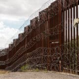 The US/Mexico border fence in Nogales, Arizona.