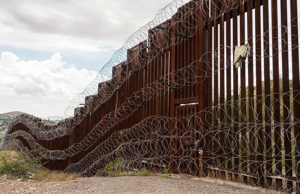 The US/Mexico border fence in Nogales, Arizona.