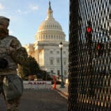 A member of the New York National Guard stands at a gate outside the U.S. Capitol the day after the House of Representatives voted to impeach President Donald Trump for the second time January 14, 2021 in Washington, DC.