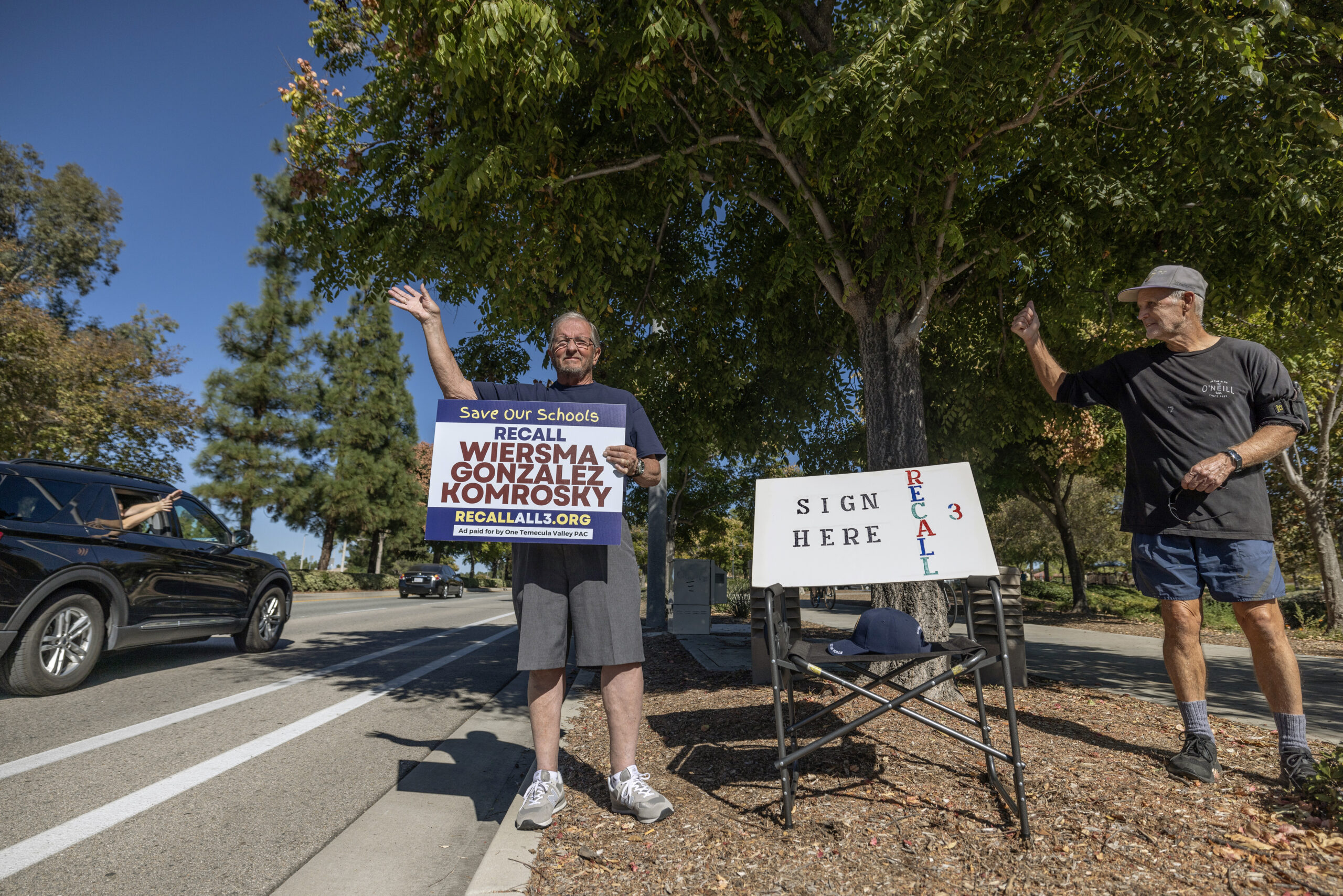 Air Force veteran Ron Larson, left, and Robert Eilek, who taught in the district for 40 years, were drumming up support for the school board trustee recall drive in Temecula on Nov. 12. Larson said, “I am fighting for this recall because the school district needs to take care of all the people in this town, not just a select few.”