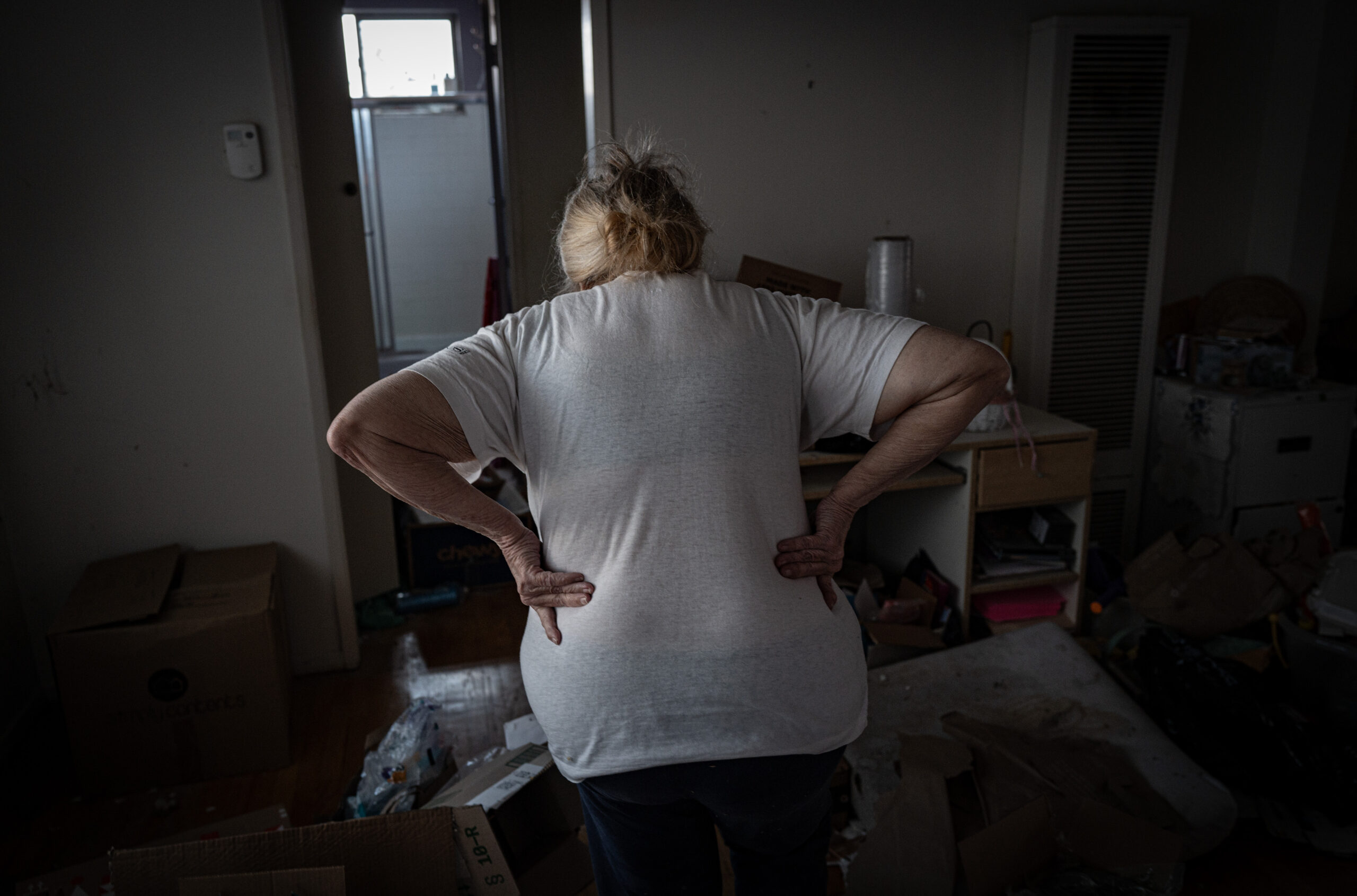 Erickson walks through her apartment, mentioning her persistent back pain and wondering aloud how she will get all of her belongings packed and moved before her eviction the next day. “I knew the eviction was coming but it just hit me really hard.”