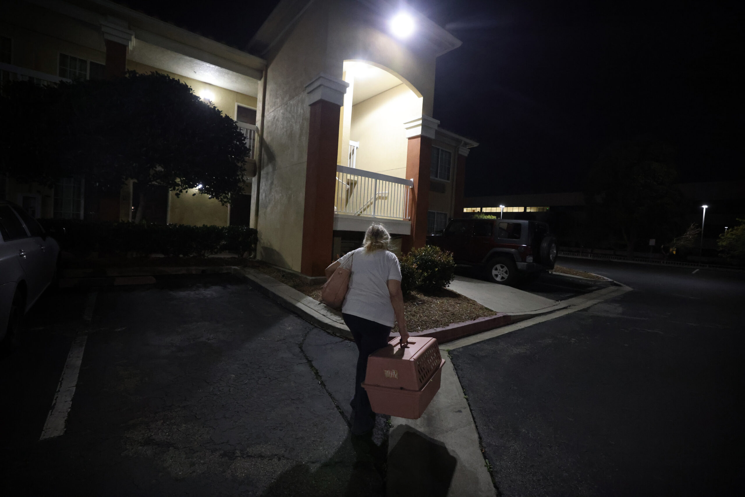 Erickson makes her way into a hotel in Playa del Rey with her cat Muriel. She did not have a long-term solution and said she would likely end up living in her car.