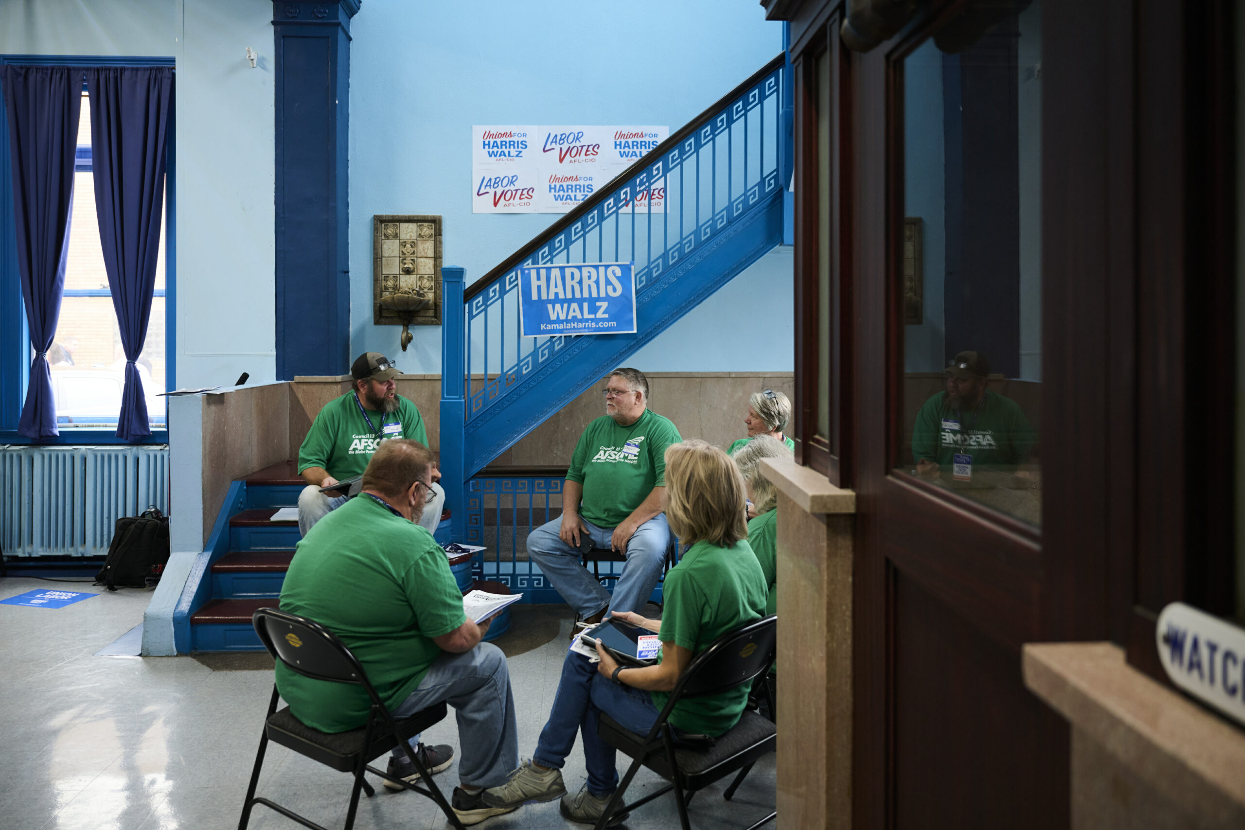 Members of the American Federation of State, County and Municipal Employees District Council 13, which represents over 65,000 workers in Pennsylvania, await remarks during a canvassing event at the United Steelworkers union hall in Erie.