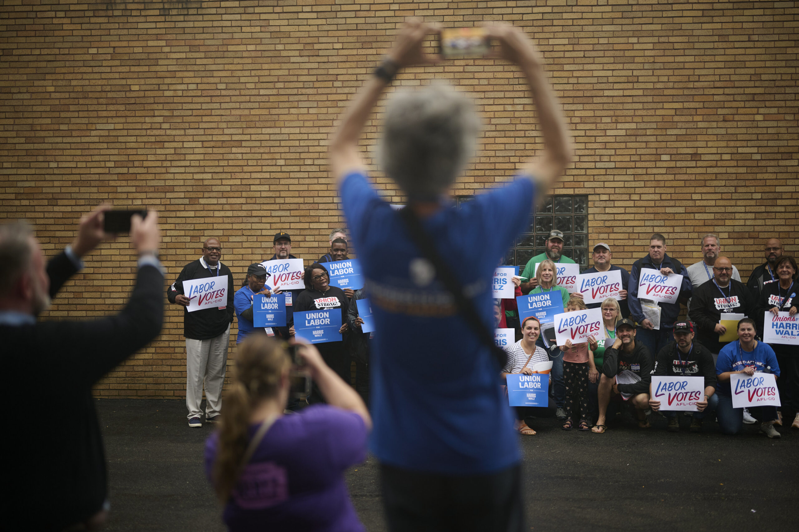 Canvassers pose for a group photo outside the United Steelworkers union hall in Erie, Pennsylvania, on Sept. 28. Photos by Dustin Franz.